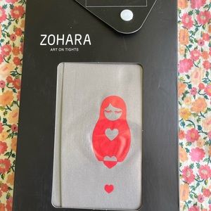 Zohara grey tights with nesting doll and hearts on the front. Adorable!